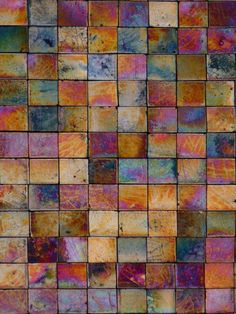 an abstract tile pattern made up of different colors