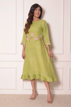 Green linen tunic with organza overlap and floral embroidery.
Component: 1
Pattern: Embroidered
Type Of Work: Thread work
Neckline: Round
Sleeve Type: Three quarter
Fabric: Linen, Organza
Color: Green
Other Details: 
Cutwork detail
Pleated hem
Note: Bag held by the model is not for sale
Occasion: Mehendi and Haldi - Aza Fashions Fitted Green Dress With Chikankari Embroidery, Festive Resham Embroidered Dress For Spring, Festive Wedding Dress With Embroidered Hem, Designer Anarkali Embroidered Dress For Spring, Anarkali Embroidered Dress For Spring, Spring Designer Resham Embroidered Dress, Spring Designer Embroidered Dress With Resham Embroidery, Designer Spring Tunic Dress, Elegant Tunic Embroidered Dress With Floral Details