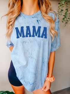 You are sure to love this cute Mama Tee  Made with Comfort Colors newest trending Color Blast Tee. It's perfect for achieving that stylish oversized look - just size up! See our Size Chart for reference.   Great gift for a super trendy Mom also!  Thanks so much for shopping with me! Please message me with any questions you may have! I am always available to help :) Also, I would love to feature you on our insta if you want to tag me @poppyroseclothing  SIZE UP 2 SIZES FOR OVERSIZED LOOK PRODUCTION TIME: 1-3 business days  SHIPPING TIME: 2-7 business days CARE INSTRUCTION: Machine wash: cold,  Tumble dry: low heat, do not iron directly on design. Do not dry clean PRINTING METHOD: DTG printing method is used for these shirts. The Comfort Colors 1745 is a unisex, unique color blast t-shirt an Fun Blue T-shirt For Father's Day, Blue Tops With Text Print For Father's Day, Casual Blue Birthday Tops, Casual Blue Tops For Birthday, Blue Custom Print Top For Mother's Day, Blue Tops With Custom Print For Gift, Blue Custom Print Top For Gift, Blue Custom Print Top As A Gift, Blue Custom Print Top As Gift