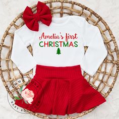 Adorable handmade red and green personalized first Christmas outfit with a matching hair bow for baby girls. *Hair bow comes on a nylon headband. Baby skirts are made out of super soft and stretchy knit fabric. Baby onesies and shirts are 100 percent cotton. Click to view more items available in my shop: www.etsy.com/shop/emmarosebabyboutique * Please also note that, although every effort is made to photograph my items accurately and describe my products in detail, I cannot guarantee every compu Newborn Christmas Outfit Boy, Christmas Outfit Red, Baby Girl First Christmas, Baby Skirts, My First Christmas Outfit, First Christmas Outfit, Baby Boy Christmas Outfit, Red Holiday Dress, Christmas Dress Baby