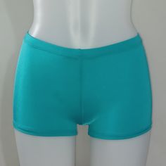 "SHINY SPANDEX BOOTY SHORTS 70 Amazing Colors to Choose From! All Sizes Available SIZING Sizing Chart in Photos If you need help with sizing, please send a message with your measurements (Waist, Hips, Thigh). If you need something larger than a 5X just let me know! CUSTOM ITEMS We are able to make changes to this item including: Inseam shorter/longer Waist higher/lower Matching top also available LEOTARDS: Long Sleeve, Short Sleeve, Tank, Halter Neck, High Neck, Scoop Neck, Low back, Camisole, Two Tone, One Shoulder, Gymnastic, Keyhole, Mens SHORTS: Booty Shorts, Spankies, Low Rise, High Waist, High Cut Legs, Briefs, Mens TOPS: Bra Top, Tank Top, Halter Top, Camisole Top, High Neck, Short/Long Sleeve BOTTOMS: Capris, Leggings, High Waist, Low Rise, Athletic Shorts, 2\" to 8\" inseam BODY W Basic Stretch Bottoms With Built-in Shorts, Green Bottoms With Built-in Shorts And Stretch, Summer Stretch Hip-length Shorts, Blue Stretch Short Leg Swim Trunks, Fitted Blue Athletic Shorts For Swimming, Blue Fitted Athletic Shorts For Swimming, Stretch Solid Shorts With Short Inseam, Summer Yoga Shorts Hip-length, Stretch Swimming Shorts With Elastic Waistband