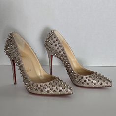 Christian Louboutin Silver Glitter Follies Spikes Pumps Features: Leather Silver Glitter Silver Spike Embellishments On Exterior Pointed-Toe Comfortable Leather-Lined Insoles 4" Heel Size: 34.5/Us 4.5 Origin: Italy *Worn Once. Minor Scuff On Top Right Foot Heel (Refer To Picture). No Box Or Dust Bag. Comes With Extra Pair Of Heel Savers. Excellent Condition Leather Silver, Christian Louboutin Shoes, Silver Glitter, Shoes Women Heels, Christian Louboutin, Embellishments, Dust Bag, Shoes Heels, Pumps