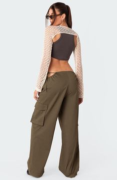 Stand out in streetwear-inspired style with these roomy cargo pants featuring flirty side cutouts, handy pockets and a low rise for a 2000s-inspired look. 100% cotton Machine wash, dry flat Imported Cargo Pants Low Rise, Pants Low Rise, Side Pants, Swimwear Dress, Side Cuts, Military Style, Military Fashion, Cut Outs, S Models