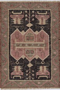 an old rug with various colors and patterns on it, including black, brown, pink, and beige