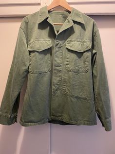 Vintage Dutch military shirt. The shirt is green with old style material. Pit to pit is approximately 20", arm length without cuff is approximately 20.5".  Contact us with any questions. Olive Military Style Cotton Top, Olive Cotton Military Style Tops, Green Cotton Utility Shirt, Green Cotton Utility Top, Olive Cotton Top With Pockets, Military Style Cotton Shirt For Fall, Khaki Long Sleeve Utility Top, Olive Long Sleeve Cotton Shirt, Vintage Olive Long Sleeve Tops