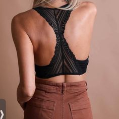 Back Laced, Color Black, Removable, Bra Pads. Seamless Perfect T-Shirt Wearing Comfortable Bralette. Also Perfect For Adding A Beautiful Detailing To Those Low Back Tank Tops. You Can Wear It Under Or Over Your Topor In Place Of It (As A Sort Of Mini Crop Top). A Bralette Really Proves Its Worth When Worn Under Anything That Has Tripped You Up Before. Try It Under A Sheer T-Shirt, Peeking Through A Crochet Sweater, And Even As The Perfect Layering Piece Under A Blazer. 92% Nylon 8% Spandex S: 32 Black Seamless Backless Top, Black Racerback Bra Friendly, Black Stretch Cami Bra, Black Cami Top With Removable Bra Pads, Black Seamless Cami Bra, Black Seamless Backless Crop Top, Black Seamless T-back Top, Stretch Black Backless Bra, Black Stretch Backless Bra