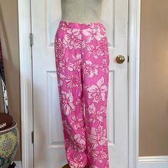 Lilly Pulitzer Silk Pink Floral Pants Size 8 Retired & Very Hard To Find Print. Pink And White Flowers Features Zip Up The Side With Button Closure And Sit At The Bottom Pant Legs 100% Silk Measure Approximately Nine Flat Waste 14 3/8 Of An Inch Rise 11 1/2 Inches Inseam 31 1/4 Inches Length 40 In A Quarter Inches New Without Tags Smoke Free Business Fitted Floral Print Pants For The Beach, Pink Floral Print Pants, Pink Full-length Bottoms For Vacation, Pink Floral Print Straight Pants, Pink Floral Print Beach Pants, Summer Floral Print Tapered Leg Bottoms, Summer Floral Print Pants For Daywear, Floral Print Summer Pants For Daywear, Pink Floral Print Full-length Pants