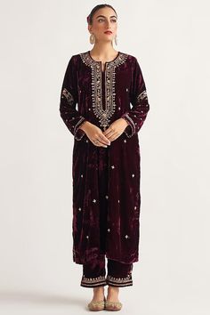 Featuring a wine kurta in velvet base with hand embroidery. It is paired with matching palazzo pants. This product will be shipped to you after 1-2 weeks from the date of order placed. All custom made orders are not returnable. Pls contact for Size chart and for other more colors Request You :To provide contact details for courier services. {VARIATION MAY COME DEPENDING UPON AVALIBILITY OF LACES OR GOTTA PATI or TUSSELS} NOTE:  1) Visual Samples on website may differ slightly from actual product due to light & effects during photography (Length & Breadth have 1 n 1.5 inches +/-). 2) Before placing order ,pls confirm product n color availability and  For Wholesale Order MOQ is 5 Pieces of any color/Pattern on +91 7903893945 & +91 8447750028(WhatsApp) Bridal lehanga ,indian wedding,Canada we Velvet Suit Design, Velvet Kurta, Velvet Embroidery, Independance Day, Pant For Women, Velvet Suit, Embroidered Pants, Suit Design, Embroidered Neckline