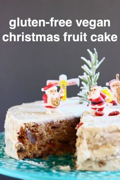 there is a cake with frosting and decorations on the top, sitting on a plate