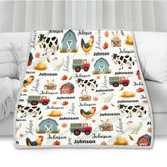 a blanket with farm animals on it