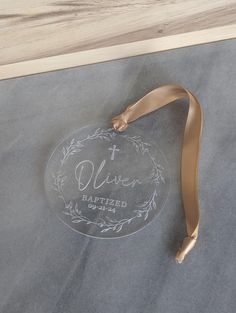 a personalized glass ornament with a ribbon