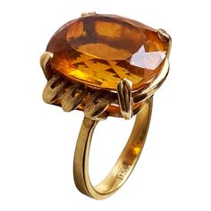 This classic 18K gold ring masterfully displays a magnificent Imperial Citrine quartz crafted in the shape of a large 06.2" x 0.5" x 0.3", weighing 6.5 grams. Size 6, ring size 1" h by 0.75" w by 0.50 " d The stone is set in a center prong style for eye-catching brilliance. This exquisite piece of jewelry is an ideal addition to any fine jewelry collection and provides excellent style and luxury. Citrine is more than just a beautiful gemstone; it carries a wealth of symbolism and cultural signif Formal Yellow Gold Rings With High Luster, High Luster Yellow Gold Rings For Formal Occasions, Formal High Luster Yellow Gold Rings, Elegant Yellow Gold Ring With Large Stone, Elegant Yellow Gold Rings With Large Stone, Formal Oval Yellow Topaz Ring, Luxury Amber Rings For Formal Occasions, Formal Yellow Oval Topaz Ring, Elegant Citrine Signet Ring For Formal Occasions