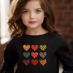 Colorful Hearts Sweatshirt with cute graphic designs.  Made with a comfortably balanced blend of 50% cotton and 50% polyester, the Gildan 18000B sweatshirt is the perfect choice for school, sports, and lounging with friends. Its medium-heavy fabric delivers a cozy, warm feeling while each sweatshirt runs true-to-size for a great fit.  .: 50% cotton, 50% polyester .: Medium-heavy fabric (8.0 oz/yd² (271.25 g/m .: Loose fit Cute Heart Graphic Tops For Fall, Cute Fall Tops With Heart Graphic, Cute Heart Print Tops For Fall, Cute Long Sleeve Tops With Heart Graphic, Cute Long Sleeve Top With Heart Graphic, Cute Heart Print Tops For Winter, Long Sleeve Cotton T-shirt With Heart Print, Cute Multicolor Long Sleeve T-shirt, Cute Long Sleeve T-shirt With Heart Print