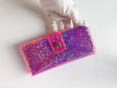 "Card wallet, travel purse, cardholder for travelers, easy to wipe, airportsecurity, travel essentials, glitter holographic, business cards Colors may vary a bit from screen to screen. For any questions please mail me I'll be happy to help you with informations about available sizes and colors ! I'm open for custom order. Dimensions:  20 x 9 cm //  7,87 x 3,54 12 slots for cards.  Made with love <3 I'm very grateful for the purchases and support of my small company during this difficult time <3 Look at another bags of my project: https://www.ypsilonbags.etsy.com We offer gift wrapping and beautiful personalized tickets. You can order our products for a gift and we will send them directly to the person you gave. Our bag are 100 % handmade. We are a legally operating company from Europe. Our Security Bag, Unique Wallets, Chocolate Party, Business Card Cases, Coin Card, Cosmetic Glitter, Travel Purse, Very Grateful, Purse Styles