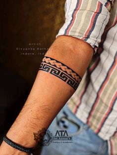 a man with a tattoo on his arm