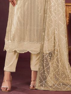 Introducing a charming beige net kameez adorned with delicate threadwork, sequin detailing, and fancy readymade lace border, creating an ensemble that exudes elegance. Paired seamlessly with a crepe salwar in a matching beige shade, this outfit is a perfect blend of sophistication and style.
Completing the ensemble is a net dupatta in a similar beige color, featuring sequin work, thread embroidery, and a fancy lace border.
The beige salwar kameez comes as an un-stitched material, accommodating s Semi-stitched Lace Work Sets For Diwali, Semi-stitched Bollywood Lace Salwar Kameez, Semi-stitched Traditional Wear With Lace Work For Eid, Designer Lace Sharara Semi-stitched, Designer Semi-stitched Beige Churidar, Elegant Net Dupatta For Designer Wear, Elegant Designer Net Dupatta, Elegant Designer Wear Net Dupatta, Beige Party Sets With Sheer Dupatta