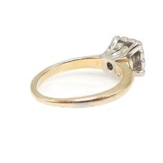 This ultra small ring (it's a size 2.5!) has a Prism Lite diamond prong set in a white gold illusion mount that's supported by a yellow gold band. The diamond is 3.75mm wide and weighs approximately 0.20ct. The illusion mount is designed to visually increase a diamond's perceived size by ensconcing it in white metal, blurring its optical boundaries. HISTORY LESSON: The Prism Lite diamond was a proprietary cut that was first trademarked in 1947. "‘Prism-Lite’ diamonds were in demand for their spe Yellow Gold Platinum Diamond Ring With Single Diamond, Vintage Diamond Ring With Tension Setting, Classic Cluster Ring With Princess Cut And Prong Setting, Classic Cluster Ring With Single Diamond In Diamond White, Classic White Cluster Ring With Prong Setting, Classic Princess Cut Cluster Ring With Diamond Cut, Classic Diamond White Cluster Ring With Single Diamond, Platinum Solitaire Ring In Yellow Gold, Classic Cluster Ring With Prong Setting