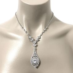 "A statement bridal necklace featuring glamorous Art Deco geometric sunrise sunshine details to make that bold yet elegant statement. This ornate, detailed silver wedding jewelry is made of clear cubic zirconia set on tarnish-resistant silver rhodium plated base and chain. Necklace length is adjustable from 17\" (43cm) to 19\" (48cm) . Matching pieces at https://etsy.me/2w9kxYn View all Victorian inspired accessories https://etsy.me/2uAseFc View all necklaces at https://etsy.me/1jokpF5" Art Deco Crystal Necklace For Wedding, Flapper Wedding, Necklace Art Deco, Crystal Wedding Jewelry, 1920s Vintage, Bridal Earrings Drop, Silver Wedding Jewelry, Necklace Art, Art Deco Pendant