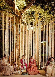 The gleaming atmosphere was incorporated with beautiful florals and bright embellishments.





#goa #wedding #weddingdesign #designer #details #florals #weddinginspiration #floraldesigner #groom #couple #bridalwear #bride #bridal #beautiful #blissful #weddingdecor #indianwedding #destinationwedding Outdoor Desi Wedding, Reception Candles, Indian Wedding Deco, Minimal Wedding Decor, Hindu Wedding Decorations, Cool Flowers, Indian Wedding Decorations Receptions, Nikah Decor, Sangeet Decor