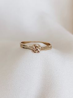 Double Knot Ring, Love Knot Ring, Gold Double Knot Ring, Knot Ring Gold, Gold Stacking Rings, Gold Knot Ring, Silver Knot Ring   This Ring is so lovely and gorgeous. Created from solid 14k gold-filled, or sterling silver round wire, this ring features an open heart-shaped with a love-knot design and presents an attractive, dainty look. Marerial: * 14K gold filled * 925 sterling silver  * 14K rose gold filled *CURRENT PRODUCTION WORKS* All items are made to order. Please check our policies page, Promise Ring Infinity, Lovers Knot Ring, Gold Rings Promise, Love Knot Jewelry, Double Knot Ring, Simple Gold Band Ring, Dainty Promise Rings Simple, Promise Ring Bands, Simple Gold Promise Rings