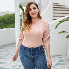 The Emes Shop tee is detailed with a gorgeous ruched sleeve detail. Features a round neck line. solid color. and bodycon fit. Pair it with denim jeans and sneakers for a laidback look.Materials: 100% PolyesterMEASUREMENTS: Product Length is 28"-30" in 1X-14W-16W | Waist: 37-39 in | Chest: 43-45 in 2X-16W-18W | Waist: 39-41 in | Chest: 45-47 in 3X-18W-20W | Waist: 41-43 in | Chest: 47-49 in 4X-20W-22W | Waist: 43-45 in | Chest: 49-51 in MEASUREMENTS: Product Length is 71-76 cm 1X-14W-16W | Waist: 94-99cm | Chest: 109-114cm 2X-16W-18W | Waist: 99-104cm | Chest: 114-119cm 3X-18W-20W | Waist: 104-109cm | Chest: 119-124cm 4X-20W-22W | Waist: 109-114cm | Chest: 124-129cm Casual Ruched T-shirt For Spring, Trendy Ruched T-shirt For Spring, Casual Blouse Shirts, Ruched Sleeve, Pleated Top, Drawstring Top, Pleat Top, Short Sleeve Pullover, Plus Size Shorts