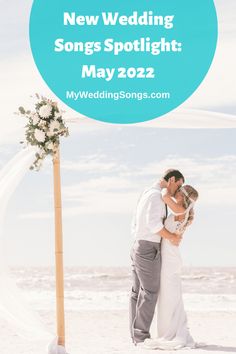 a newly married couple kissing under an arch with the words new wedding songs spotlight may 22