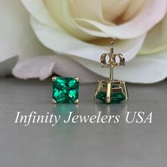 "These earrings are radiant cut lab created emeralds made set in 14k yellow gold item #6326 *also shown in 14k white gold Earring back style is subject to change due to availability. -Approximate total carat weight: 2.00ctw. -Center Stone Size: 1.00ct each 6x6mm -Metal Type and Purity: 14K yellow Gold -Setting: 4 Prong Basket Style -Backing: Screw back (earring backs are subject to change due to availability) -Gem Type: Lab Created Emerald -Stone Shape: Asscher Cut -Stone Clarity: VS2 -Stone Col Classic Emerald Earrings For Anniversary, Classic Green Diamond Cut Earrings, May Birthstone Rectangular Jewelry With Prong Setting, Emerald Earrings With Diamond Cut For Gift, Emerald Diamond Cut Earrings Gift, Rectangular Prong Setting Jewelry For May Birthstone, 14k Gold Rectangular Earrings For Anniversary, Emerald Rectangular Earrings For May Birthstone, Anniversary Jewelry With May Birthstone In Square Cut