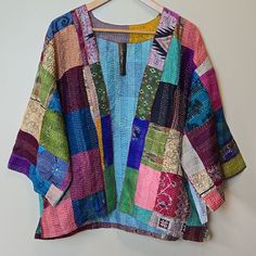 Size: L / Xl Fits Sizes: 10/ 12 / 14 Color: Multi-Color Patchwork 100% Silk New With Tags Approx. Measurements: Armpit To Armpit: 25" ( Front Closed ) Length: 26" Aratta's Audrey Kimono Jacket Features A Unique Patchwork Pattern And Meticulous Hand Stitching Detail. Every Jacket Is Distinct, With No Two Pieces Being Identical. It Showcases A Banded Front Closure And A Contrasting Inner Floral Print, As Well As A Boxy Fit With Bracelet Sleeves. Each Kimono Is One Of A Kind Patchwork. Coatigan, Cl Easy Kimono Pattern, Kimono Jacket Sewing Pattern, Kimono Blouse Pattern, Quilted Coat Pattern, Silk Patchwork, Clothing Projects, Patchwork Kimono, Kimono Blouse, Unique Jackets