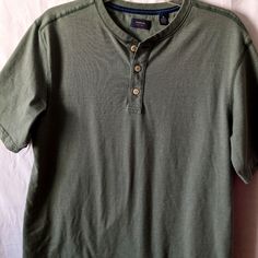 Two Men's Size Medium Button Collar T-Shirt. One Is Sage Green The Other Is Grey. Both Never Worn. Cotton Crew Neck Shirt With Button Closure, Classic Cotton Henley With Buttons, Classic Cotton Henley, Casual Henley Tops With Placket, Casual Henley Neckline Top With Placket, Short Sleeve Cotton Henley With Buttons, Casual Henley With Buttons And Crew Neck, Casual Cotton Henley With Buttons, Casual Cotton T-shirt With Placket