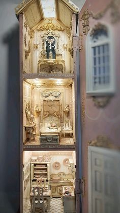 a doll house with furniture and accessories in it's display case on the wall