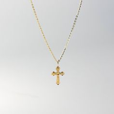 This is the perfect religious pendant to wear if you're looking for a crucifix necklace that shows nothing but Jesus and His act of love for the world. Neat and simple, you will be reminded of how Jesus Christ sacrificed His life for your sins. This 14K solid gold Catholic crucifix pendant will be a simple reminder for you or someone you love of Jesus and His unconditional love. Pair it with a fine gold chain and wear it close to your heart. The religious piece is 100% tarnish-free and will radi Gold Crucifix Necklace, Dainty Cross Necklace, Catholic Crucifix, Catholic Necklace, Crucifix Necklace, Red Tiger, Gold Chain With Pendant, Swarovski Crystal Necklace, Gold Cross Pendant