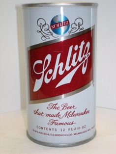 a can of beer sitting on top of a counter