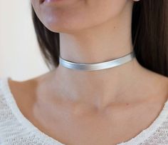 "silver Choker Necklace, Tattoo choker Necklace, Faux Leather Choker, Dainty Choker Necklace, Boho Chic Choker, Neck Choker, Silver Choker I LOVE this Faux Leather Silver choker necklac , this choker is a MUST have for your wardrobe , this necklace is perfect for any kind of weather time or type of women .We ladies love to keep it simple and trendy. Unless stated otherwise, the length of our chokers band is 11\"-12\" inches and includes a 3\" inches Silver/Gold Plated chain extender attached for Gold Neck Choker, Tattoo Choker Necklace, Necklace Tattoo, Choker Necklace Silver, Dainty Choker Necklace, Tattoo Choker, Choker Silver, Dainty Choker, Choker Style Necklace