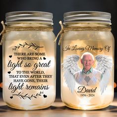 two mason jars with an image of a man and woman on the lids, both decorated with angel wings