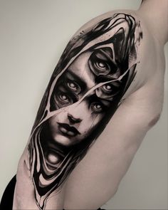 a man's arm with an artistic tattoo design on it, depicting the face of a woman