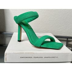 Elevate Your Shoe Game With These Stunning Good American Heels. The Green Terry Cloth Upper Material Is Soft To The Touch And Adds A Unique Touch To Any Outfit. The Square Toe And Ultra High Stiletto Heel Make A Statement, While The Slip On Closure Ensures Easy Wear. Perfect For Any Occasion, These Heels Are A Must-Have For Any Fashion-Forward Woman. Green Heels With 4-inch Heel For Party, Green Open Heel Padded Heels, Green High Heels With Padded Heel, Green Open Toe Heels With Heel Strap, Green Open Heels With Padded Heel, Modern Green Ankle Strap Heels, Green Open Toe Heels For Party, Green Heels With Padded Heel, Green Open Heel Heels With Padded Heel