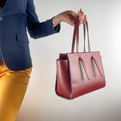 This leather bag, like all the others, uses our original ideas and handicrafts  Our quality is always higher than the price, see for yourself. A capacious business-style bag made in a fashionable trapeze shape. High quality smooth leather from the well-known Italian manufacturer Mastrotto was used. Luxurious quality. Easily accommodates all women's accessories along with documents for work or study, and much more. Very nice burgundy color. The large interior compartment closes with a zipper, and Handbag Business, Business Bag, Zipper Bags, Green Leather, Bag Women, Leather Purse, Leather Handbag, Smooth Leather, Girlfriend Gifts