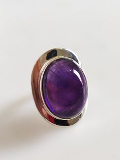 Gorgeous African Amethyst Ring Made with Sterling Silver Handmade Ring Made in india Ring Gemstone Size: 20x16 MM Top Quality Natural Amethyst Ring made with Sterling Silver 925 lovely Ring Very comfortable Ring Purple Amethyst Oval Cabochon Ring, Oval Amethyst Cabochon Ring, Purple Oval Cabochon Ring, Purple Oval Cabochon Hallmarked Ring, Hallmarked Oval Cabochon Amethyst Ring, Purple Oval Cabochon Ring For Gift, Purple Oval Stone Setting Rings, Purple Cabochon Amethyst Ring, Purple Oval Ring With Stone Setting