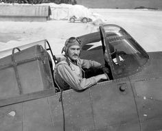 a man sitting in the cockpit of an airplane