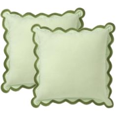 two light green pillows with scalloped edges