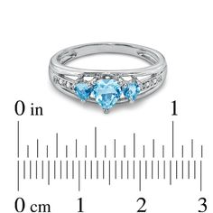 On her December birthday, say "I love you" with a trio of shimmering hearts. A glamorous look she's certain to adore, this sterling silver ring features three majestic heart-shaped blue topaz gemstones standing proudly atop the triple split shank. Dazzling diamond accents grace the shank, giving the ring just a hint of extra sparkle. Polished to a brilliant shine, it's a look she'll turn to day after day. Custom made to fit her ring size. Sterling silver rings cannot be resized after purchase. Anniversary Three-stone Blue Topaz Ring, Three-stone Blue Topaz Ring For Anniversary, Blue Topaz Three Stone Ring For Anniversary, Three Stone Blue Topaz Ring For Anniversary, Fine Jewelry Three Stone Topaz Ring For Anniversary, Anniversary Three Stone Topaz Ring Fine Jewelry, Three Stone Topaz Anniversary Ring, Anniversary Three-stone Blue Topaz Jewelry, Blue Three Stone Birthstone Ring For Anniversary