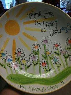 a plate with flowers painted on it that says, thank you for happy us all