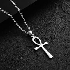 925 Sterling Silver Ankh Necklace 𓋹☥𓂀 𓋹 𓁈 ☬ A great piece to add to every outfit! Stylish men's chains that you can combine with your clothes with the elegance of İpek Silver! * Product Detail Product Content: 925k Silver Necklace length is 60 cm and is made of 925k silver. All our products are sent with İPEK SİLVER Guarantee. Since our products are handcrafted, there may be + - 5% deviation in mine weights. Ankh is a symbol that is considered a symbol of life in Ancient Egyptian mythology. It is usually depicted as a cross, with the upper part turning into a circle and the lower part forming an upright and elongated ""T"" shape. The Ankh symbol represents life, eternity of life and rebirth. It is a symbol frequently displayed on the hands of gods in ancient Egypt and was associated wi Ancient Egyptian Mythology, Ankh Symbol, Ankh Pendant, Egyptian Ankh, Necklace Woman, Ankh Necklace, Spiritual Necklace, Modern Mens Fashion, Black Circle