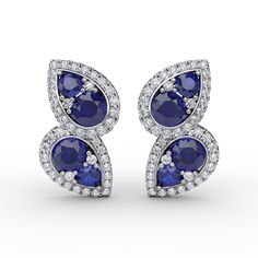 14K White Gold 8 Sapphires = 1.72ctw. 74 Round Brilliant-cut Diamonds = 0.46ctw., H-I/VS2-SI1 The earrings measure 17mm tall and 11mm wide. Luxury Blue Round Cut Earrings, Luxury Sapphire Earrings In Elegant Style, Luxury Blue Earrings With Polished Finish, Luxury Blue Earrings With Intricate Design, Luxury Sapphire Round Cut Earrings, Luxury Sapphire Diamond Earrings As Gift, Luxury Sapphire Earrings Elegant Style, Luxury Round Earrings With Gemstone Accents, Luxury Sapphire Diamond Earrings With Round Cut