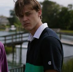 two young men standing next to each other