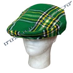 An Irish Green Tartan Flat Cap, also known as a gentleman's hat, is a classic and stylish headwear option. This type of cap typically features a distinctive Irish tartan pattern in shades of green, giving it a traditional and eye-catching appearance. It's designed to be one-size-fits-all, often with a velcro fitting mechanism, allowing for easy and adjustable wear to ensure a comfortable fit. The flat cap is a versatile accessory that adds a touch of Irish heritage to one's attire, making it suitable for various occasions, from casual outings to more formal events. Its combination of traditional design and modern convenience with the velcro fitting makes it a popular choice for those looking for both style and comfort in their headwear. black good quality of lining inside and adjustable ve Green Flat Brim Hat, One Size Fits Most, Classic Green Hat With Flat Brim, Classic Green Hat One Size Fits Most, Classic Green Flat Brim Hat, Vintage Green Hat, Casual Green Brimmed Mini Hats, Retro Green Hat With Short Brim, Green Retro Hat With Short Brim, Vintage Green Adjustable Mini Hats