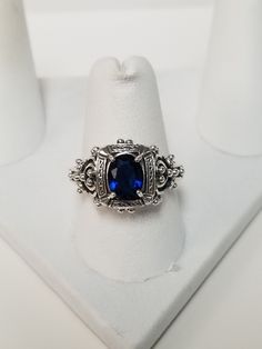 "Thanks for shopping our vintage estate store. We tend to sell well below wholesale and truly hope you enjoy all of our items. Many of the items are one of a kind, so please enjoy scrolling through the pictures and hopefully something will catch your eye. Black spots are from camera. Nice estate sterling silver 925 created blue 1ct Sapphire filigree ring. This is a custom made ring, meaning we added the gem to the setting. Ring size: please select a size Setting: 5/8\" 10mm Band width: 2mm Weigh Vintage Sapphire Jewelry With Accent Stones, Vintage Sapphire Jewelry With Center Stone, Vintage Sapphire Jewelry With Intricate Design, Vintage Sterling Silver Sapphire Ring With Center Stone, Vintage Silver Sapphire Ring In Sterling Silver, Antique Silver Sapphire Ring Collectible, Antique Silver Sapphire Collectible Ring, Vintage Sapphire Sterling Silver Ring, Vintage Sterling Silver Sapphire Ring