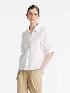 -Classic and elegant   -V-neck design   -With a silk scarf   This shirt exudes timeless elegance with its loose-fitting style and refined details. The puff sleeves add a touch of femininity, while the tapered cuffs provide a subtle contrast with their understated simplicity. The V-neck design enhances the neckline. Its clean lines and minimalist design epitomize classic sophistication, making it a versatile piece for various occasions. The shirt comes with a luxurious silk scarf, allowing for en Classic V-neck Blouse With Relaxed Fit, Classic V-neck Relaxed Fit Blouse, Elegant V-neck Top With Cuffed Sleeves, Elegant V-neck Shirt For Daywear, Elegant V-neck Blouse With Relaxed Fit, Formal Tops With Puff Sleeves And Cuffed Details, Classic Tops For Workwear With Balloon Sleeves, Classic Workwear Top With Balloon Sleeves, Classic Balloon Sleeve Tops For Workwear