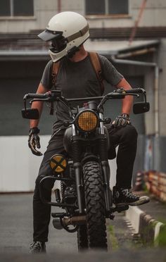 a man riding on the back of a motorcycle