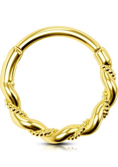 a yellow gold ring with twisted details